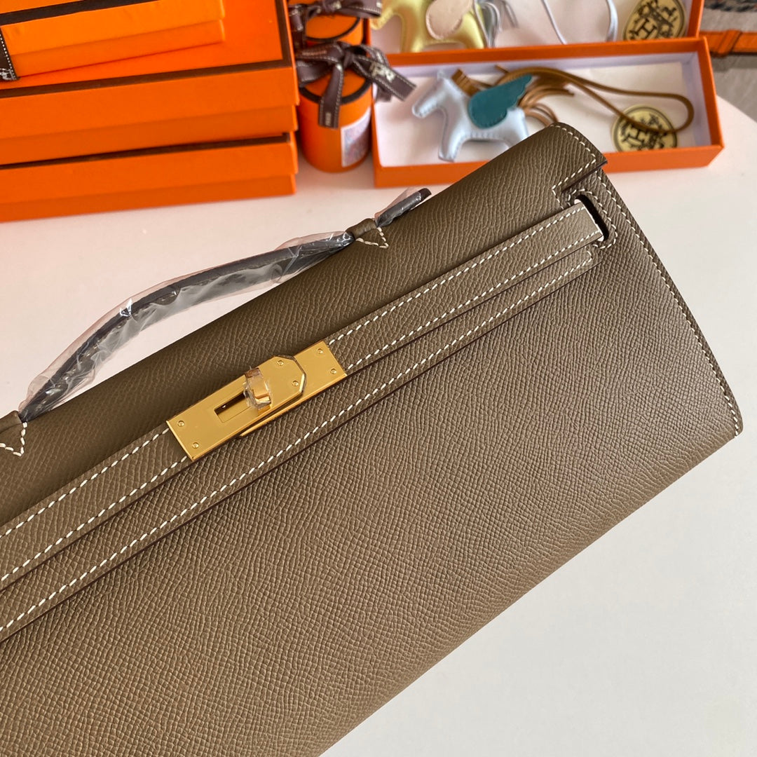 HERMES KELLY CUT 31 IN MOCHA BROWN CALFSKIN WITH GOLD HARDWARE