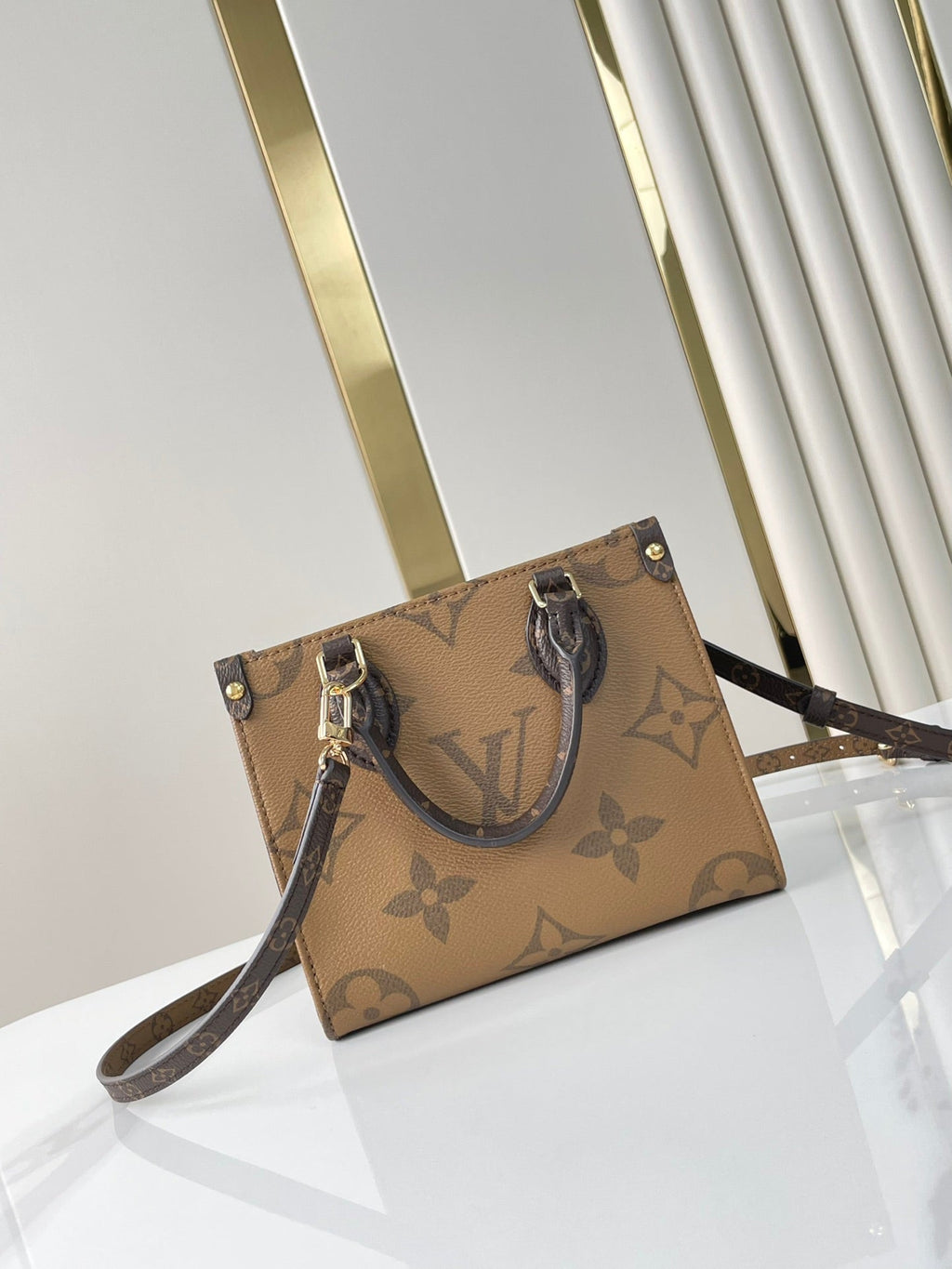 LOUIS VUITTON ONTHEGO BB 18 IN BROWN MONOGRAM AND MONOGRAM REVERSE CANVAS