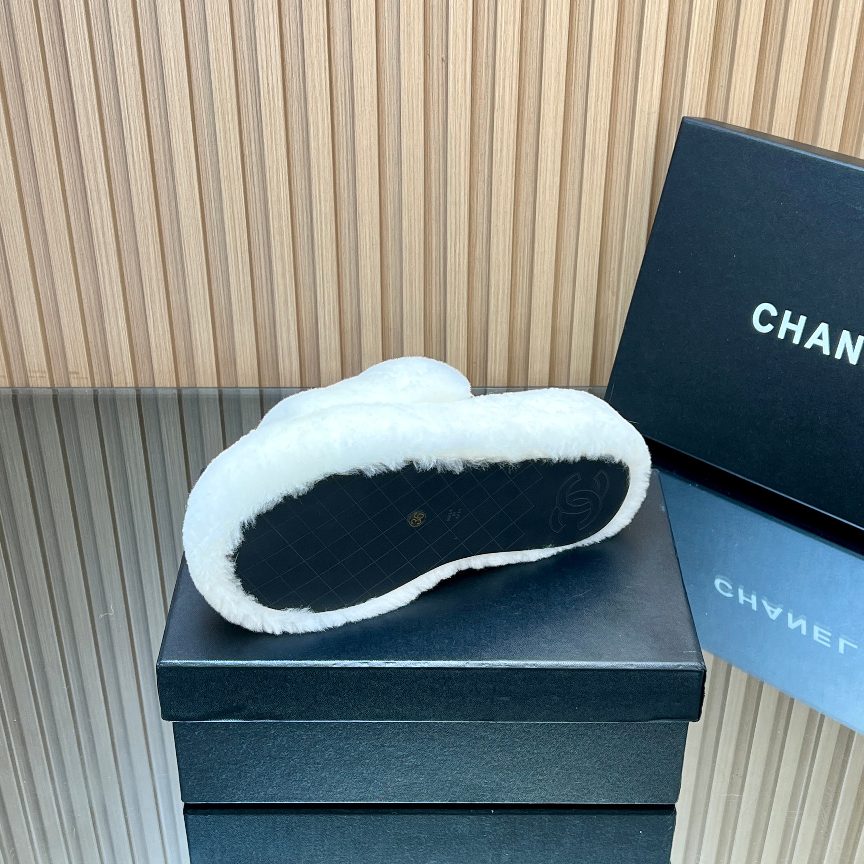 CHANEL 25S THICK-SOLED FURRY SLIPPERS WITH ELASTIC STRAPS IN WHITE FUR
