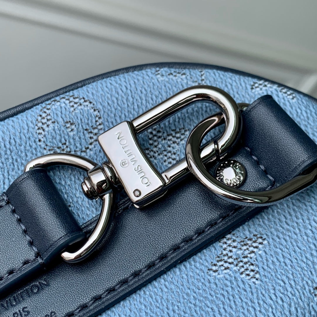 LOUIS VUITTON KEEPALL BANDOULIÈRE 25 INSKY BLUE MONOGRAM HERITAGE CANVAS DARK BLUE CALFSKIN