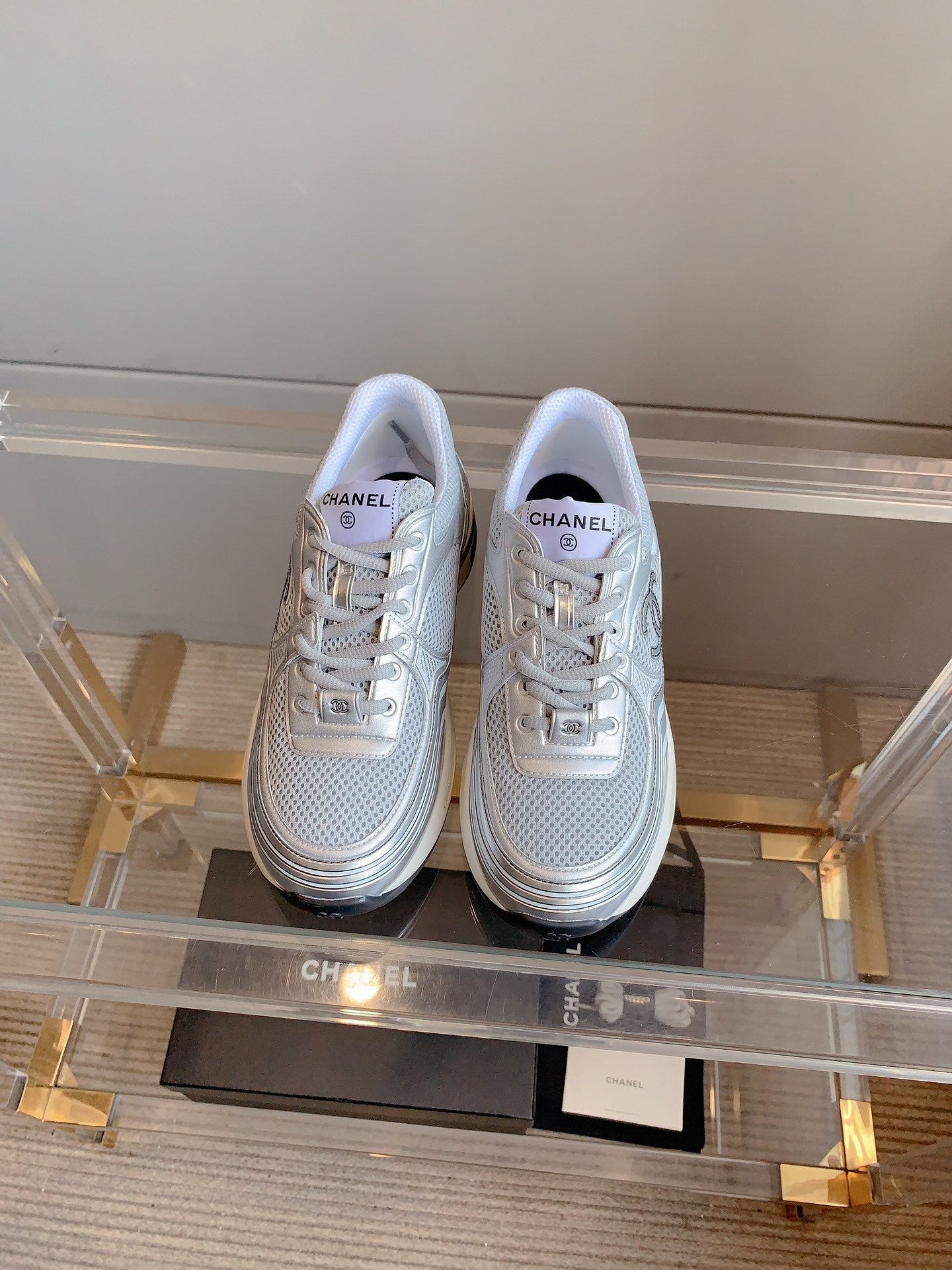 CHANEL SNEAKERS IN GLOSSY SILVER CALFSKIN AND MESH