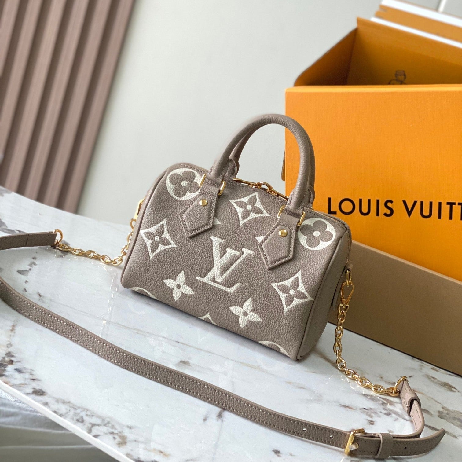 LOUIS VUITTON SPEEDY BANDOULIÈRE 20 IN TAUPE BROWN AND WHITE MONOGRAM EMPREINTE LEATHER