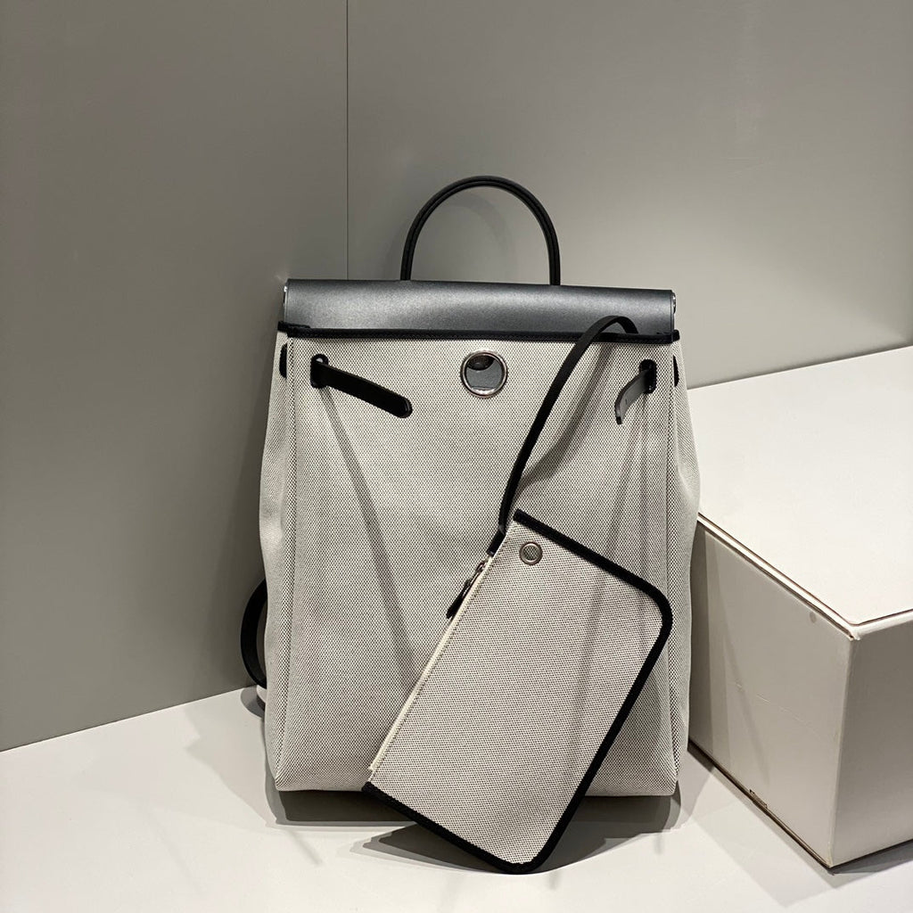 HERMES HERBAG A DOS ZIP RETOURNE BACKPACK 29 IN OFF-WHITE CANVAS AND BLACK CALFSKIN