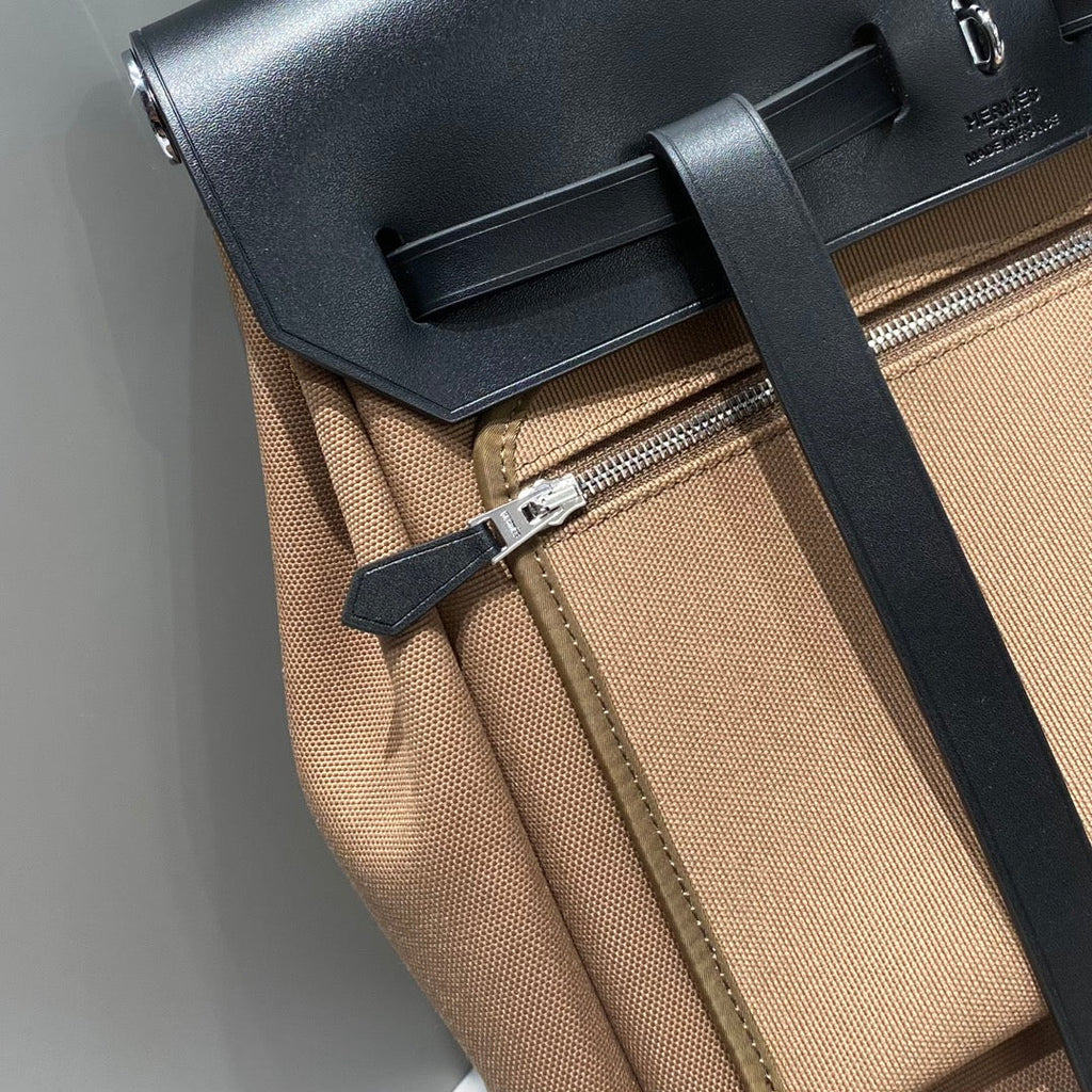 HERMES HERBAG A DOS ZIP RETOURNE BACKPACK 29 IN BROWN CANVAS AND BLACK CALFSKIN