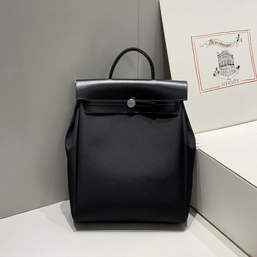HERMES HERBAG A DOS ZIP RETOURNE BACKPACK 29 IN BLACK CANVAS AND CALFSKIN