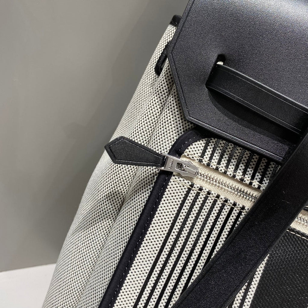 HERMES HERBAG A DOS ZIP RETOURNE BACKPACK 29 IN OFF-WHITE MIX BLACK CANVAS AND CALFSKIN