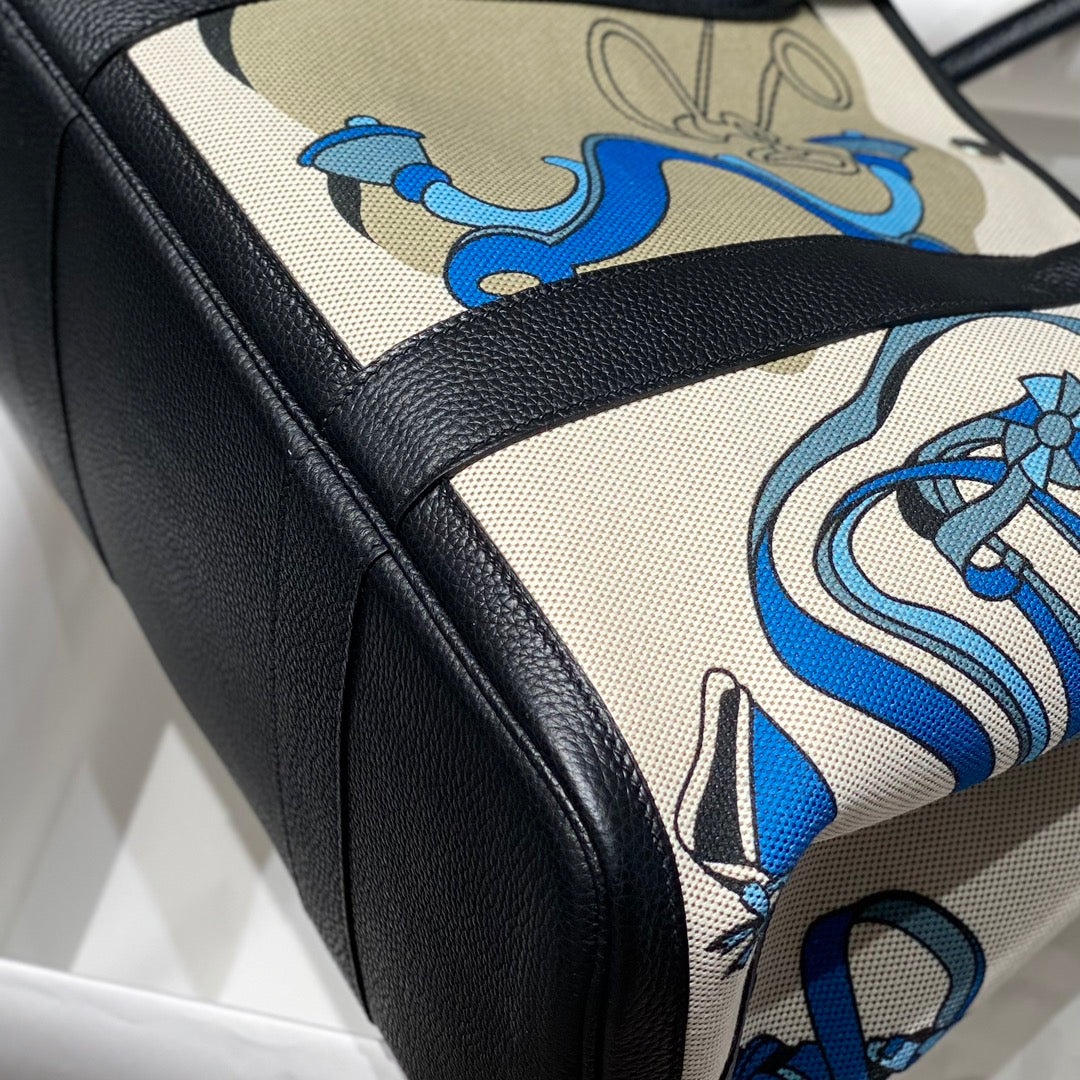 HERMES GARDEN PARTY 36 IN BLUE IVORY TOILE H CANVAS BLACK CALFSKIN EQUESTRIAN HARNESS PRINT