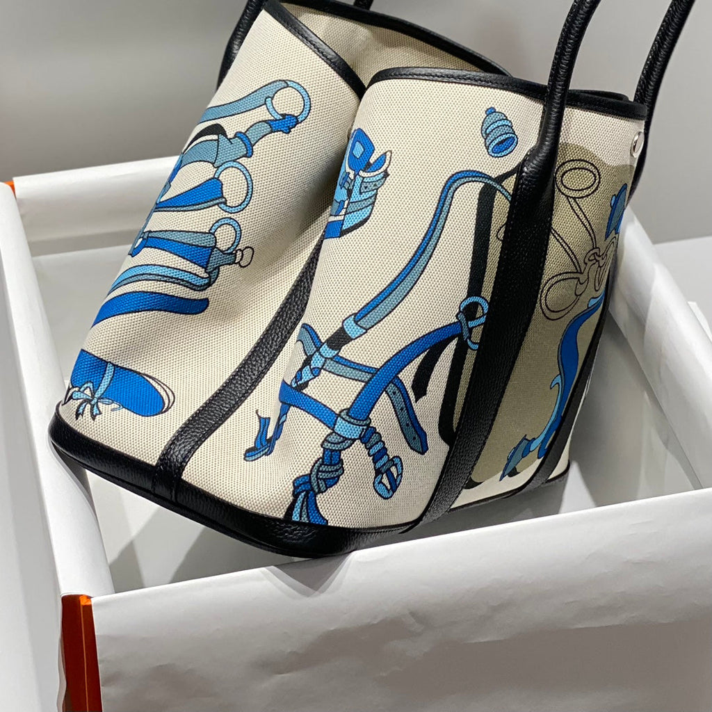 HERMES GARDEN PARTY 36 IN BLUE IVORY TOILE H CANVAS BLACK CALFSKIN EQUESTRIAN HARNESS PRINT