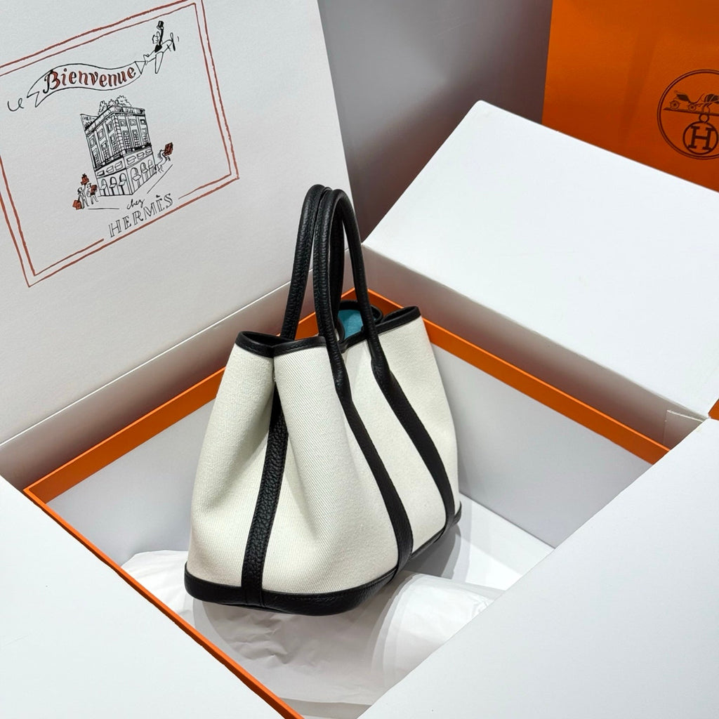 HERMES GARDEN PARTY 30CM IN WHITE TOILETS COTTON CANVAS AND BLACK CALFSKIN SKY BLUE CANVAS ON SIDE OTHER