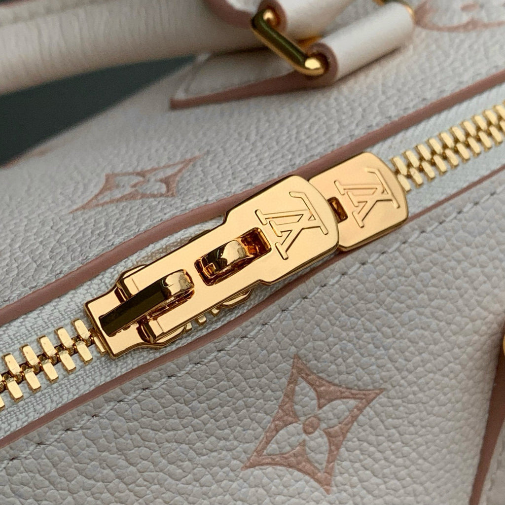 LOUIS VUITTON SPEEDY BANDOULIÈRE 20.5 IN LIGHT PINK MONOGRAM EMPREINTE CANVAS
