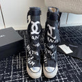 CHANEL HIGH BOOTS IN BLACK CANVAS