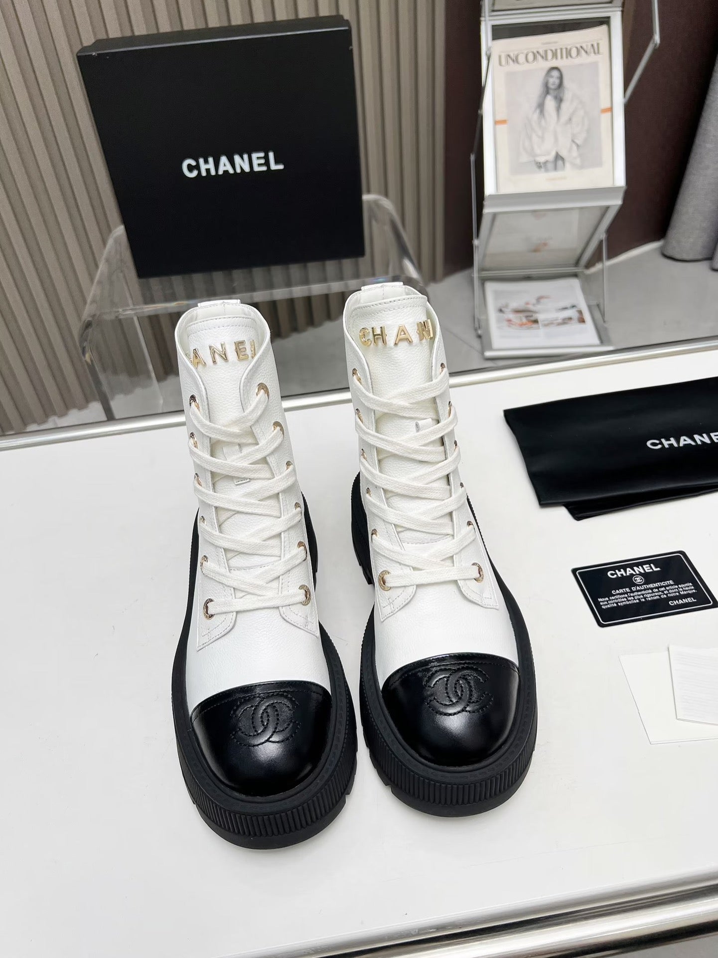CHANEL SHORT BOOTS IN WHITE MIX BLACK COWHIDE