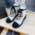 CHANEL COMBAT BOOTS IN WHITE WRINKLED CALFSKIN AND BLACK GROSGRAIN WITH FAUX PEARL