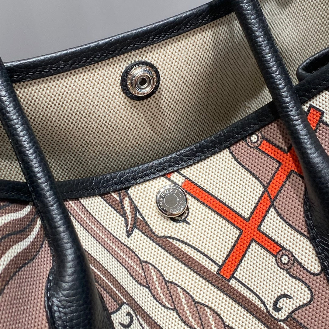 HERMES GARDEN PARTY 36 IN BEIGE ORANGE AND BROWN TOILE H CANVAS BLACK CALFSKIN HORSE TOTEM PRINT