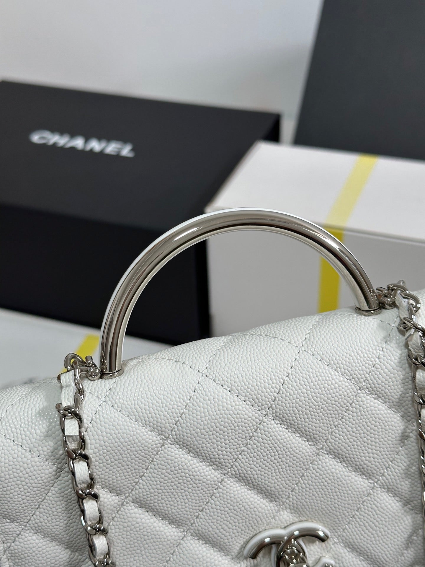 CHANEL FLAP BAG WITH SILVER-TONE HANDLE 19 IN WHITE CAVIAR SKIN