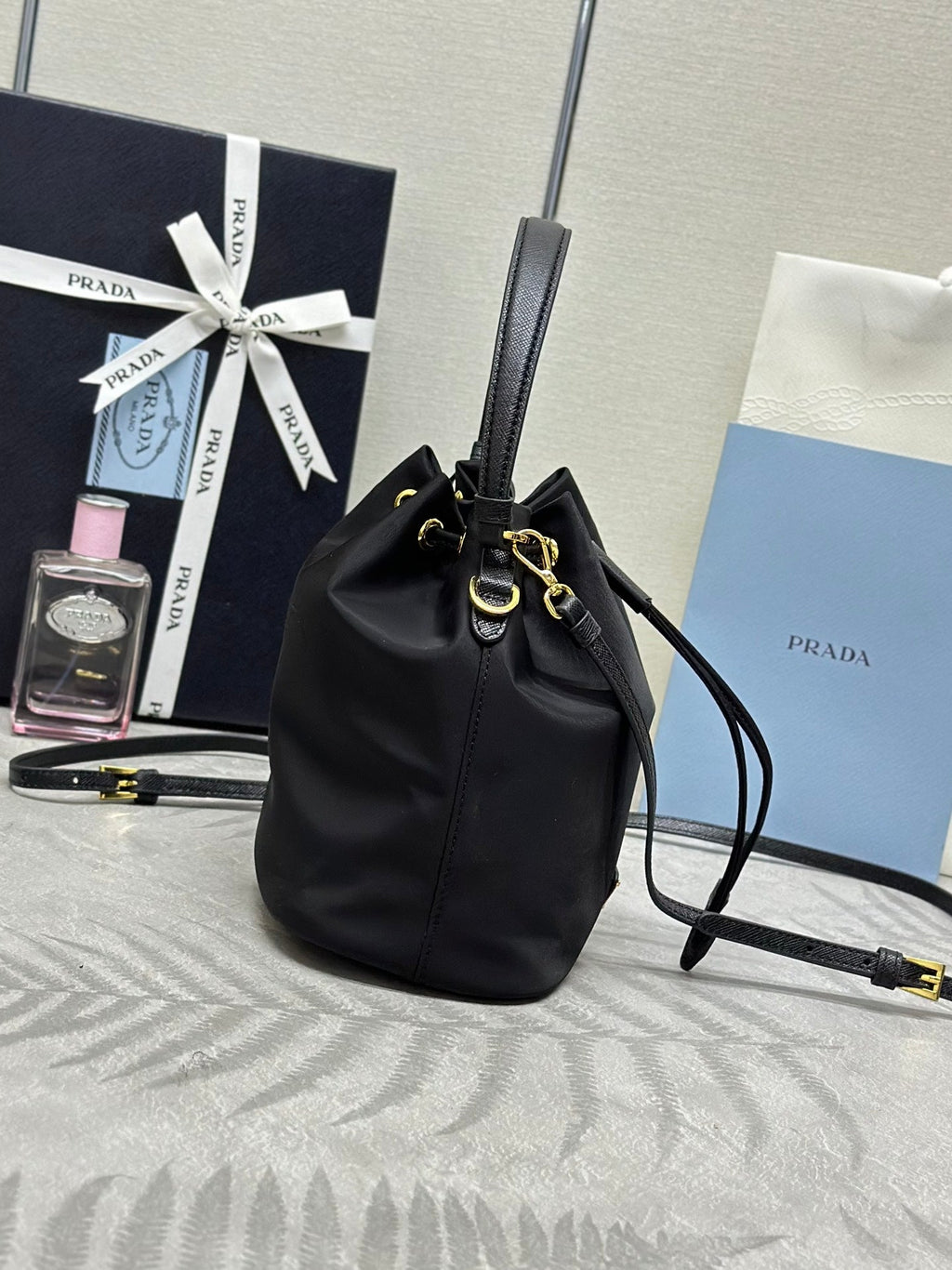 PRADA BUCKET BAG 19 IN BLACK RE-NYLON AND CALFSKIN HANDLE