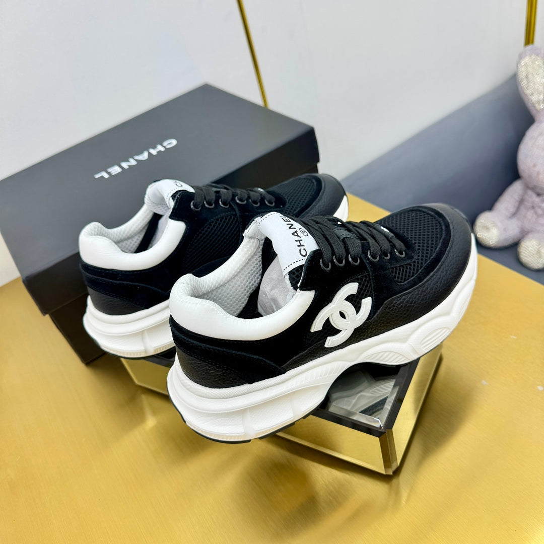 CHANEL SNEAKER IN BLACK WITH WHITE LOGO CALFSKIN AND MESH