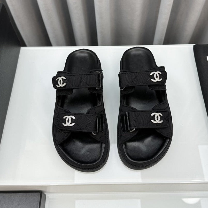 CHANEL dad sandals black textile mules