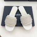 CHANEL FLAT SLIDE IN WHITE CALFSKIN WITH PEARLS